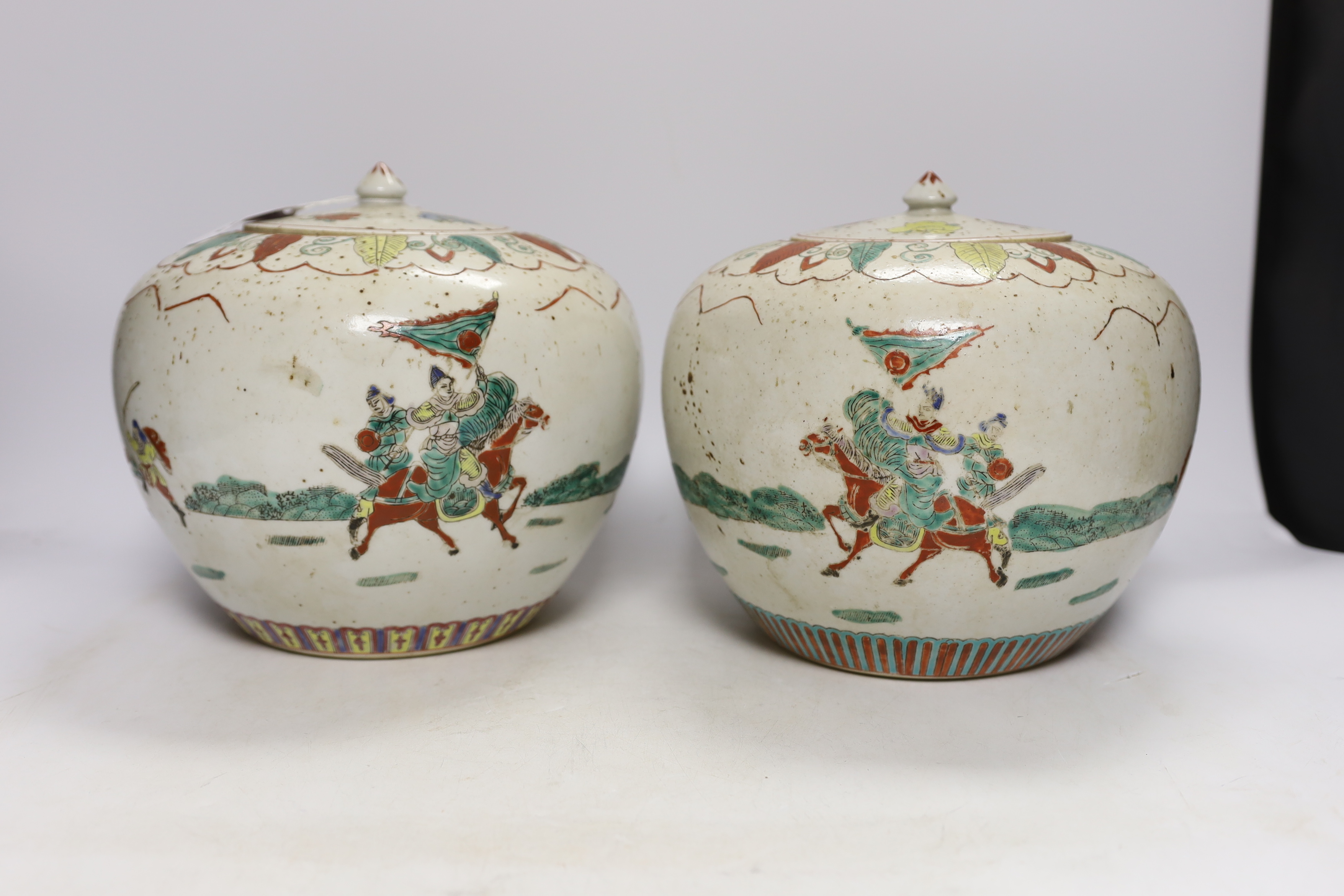 A pair of Chinese famille rose jars and covers